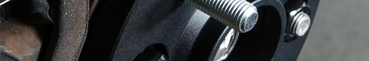 Black anodised wheel spacer fitted to vehicle