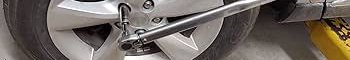 Wheel bolts being removed from vehicle