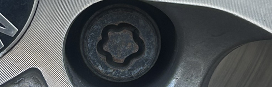 Locking wheel bolt with unique patterned head